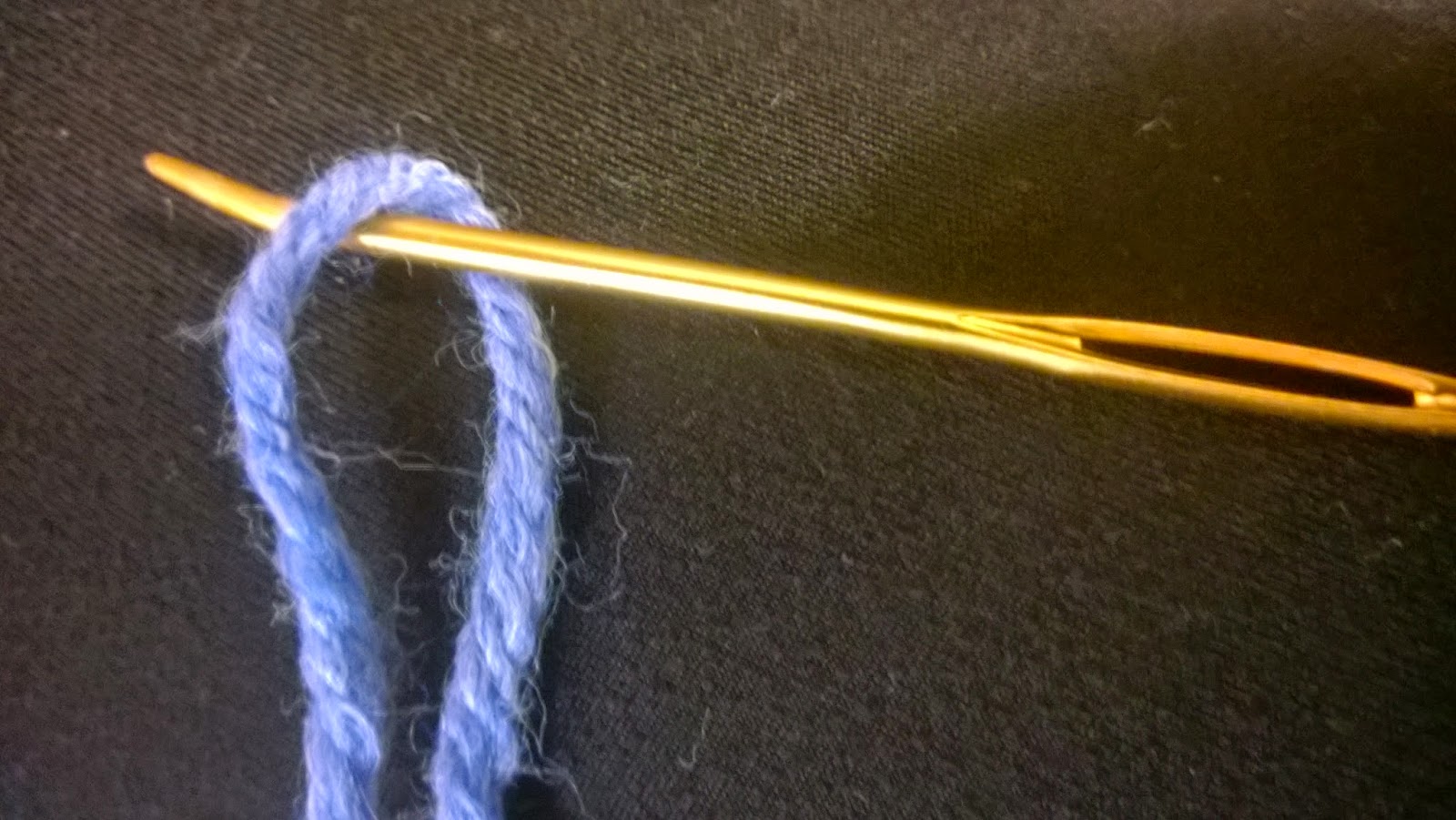 Gardner Street Threading a Needle with Yarn
